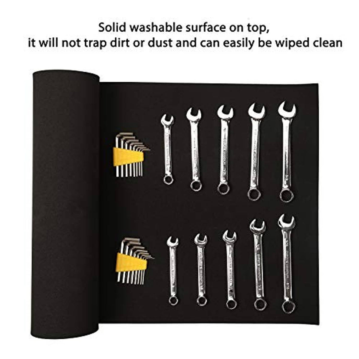 Black tool box liner mat with hand tools, non-slip surface for organized drawer storage
