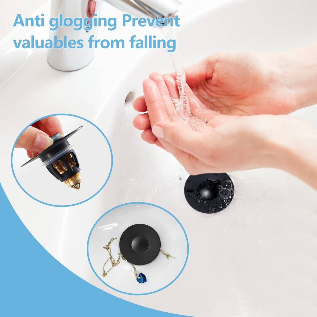 Matte black pop-up drain stopper in a white bathtub basin with water droplets