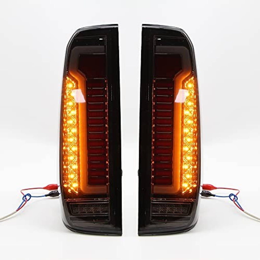 LED tail light assembly pair showing amber LED perimeter glow and red inner bars in black housings
