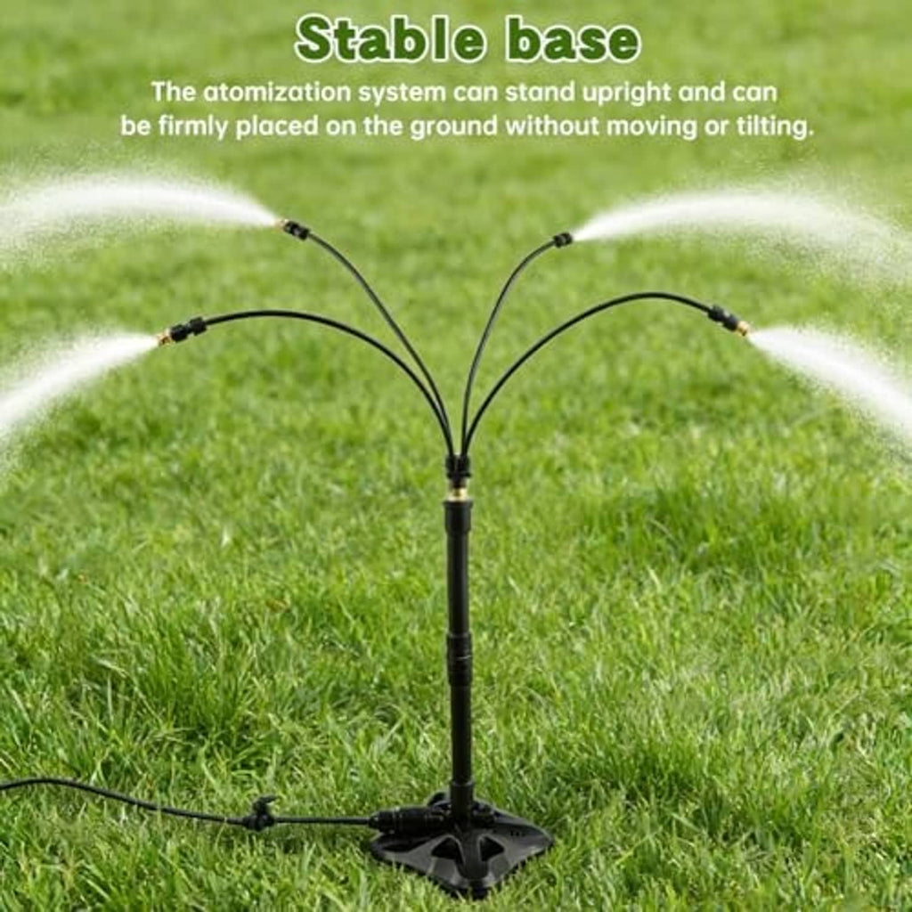 Black misting stand with star base and curved spray branches over grass