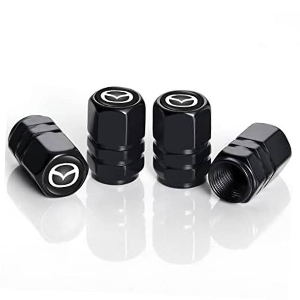 Set of four black metal tire valve stem caps with Mazda emblem, side view