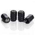 Set of four black metal tire valve stem caps with Mazda emblem, side view