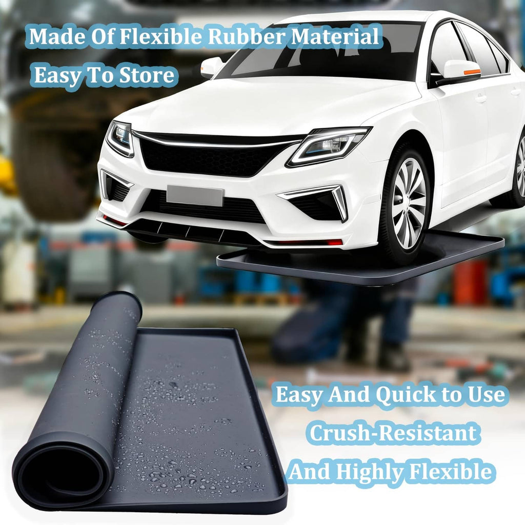 Flexible black oil drip pan on the floor beside a car, rolled for storage
