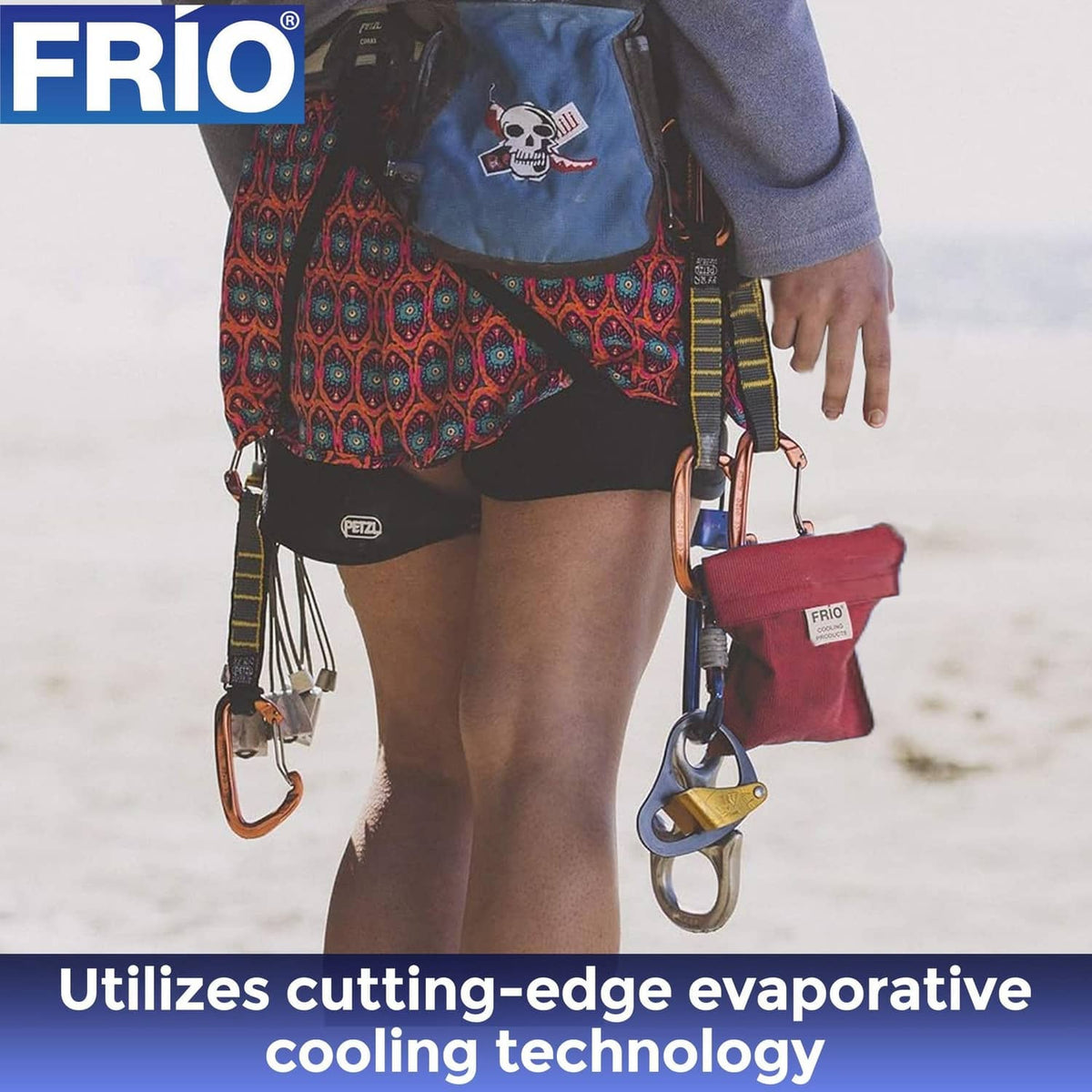 Red FRIO cooling wallet worn with clips and carabiners, hanging at side