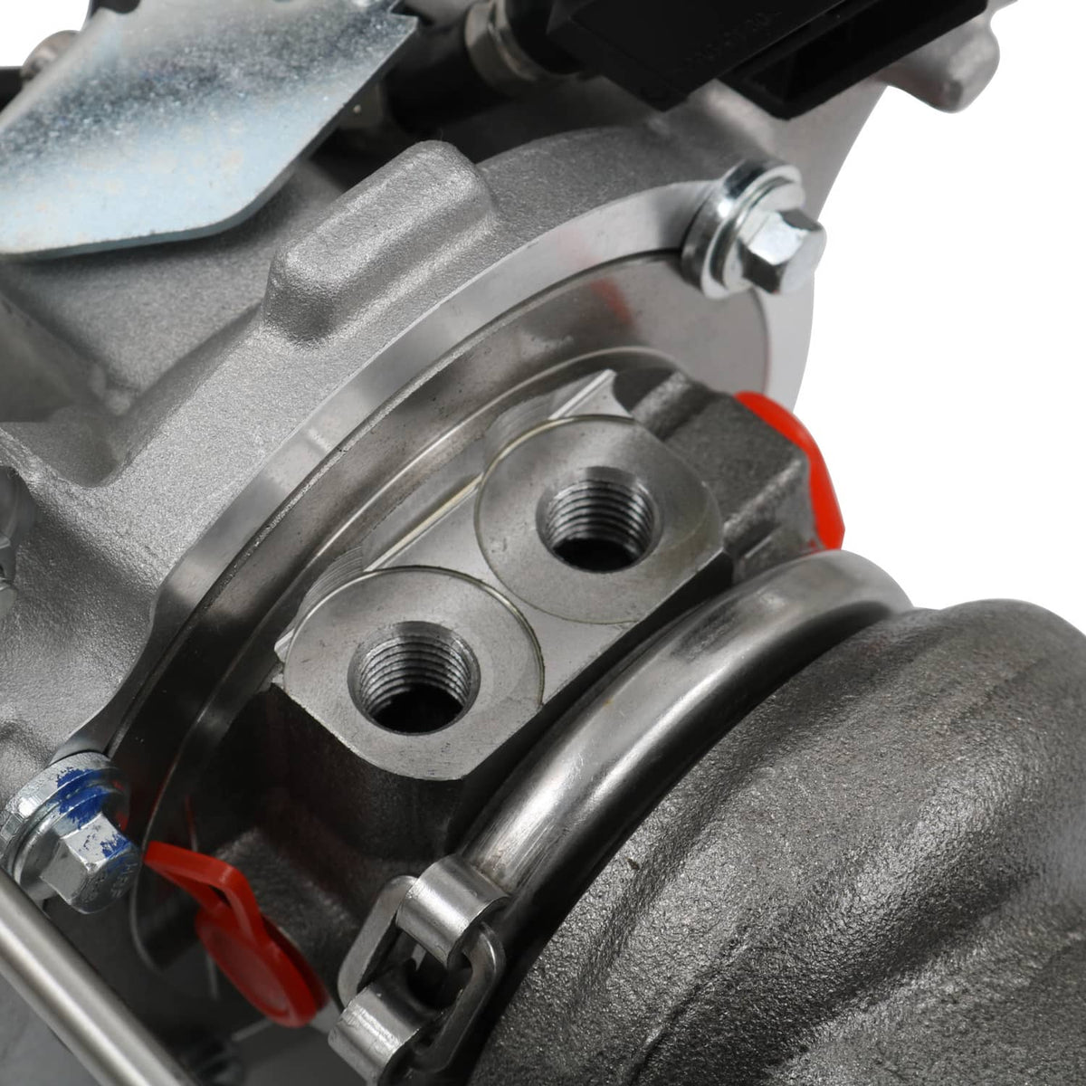 Turbocharger compressor side with threaded ports, bolts, and red locking clips