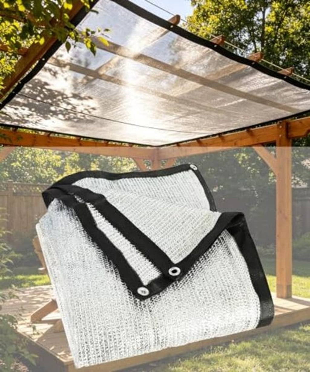 Silver shade cloth with black binding and metal grommets on outdoor supports