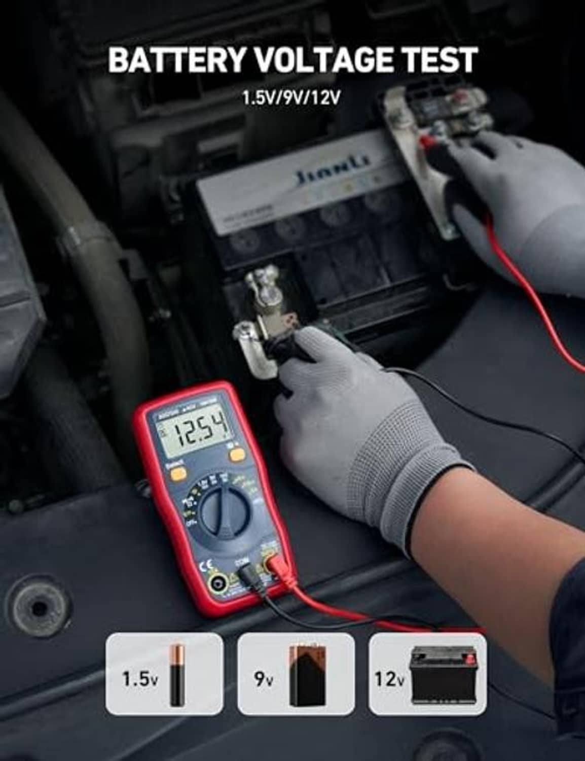 Digital multimeter voltmeter in glove showing battery voltage reading with test leads