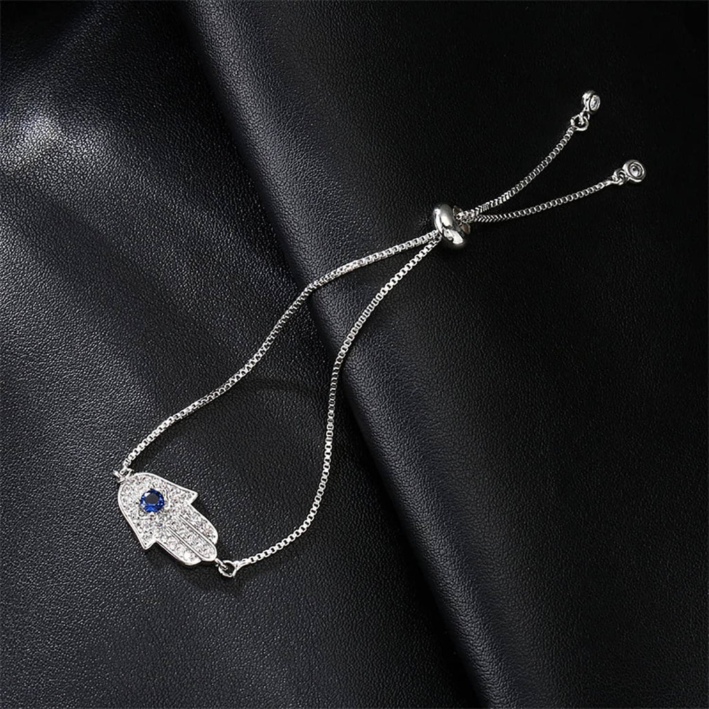 Silver hamsa charm bracelet with blue center stone and beaded side chains