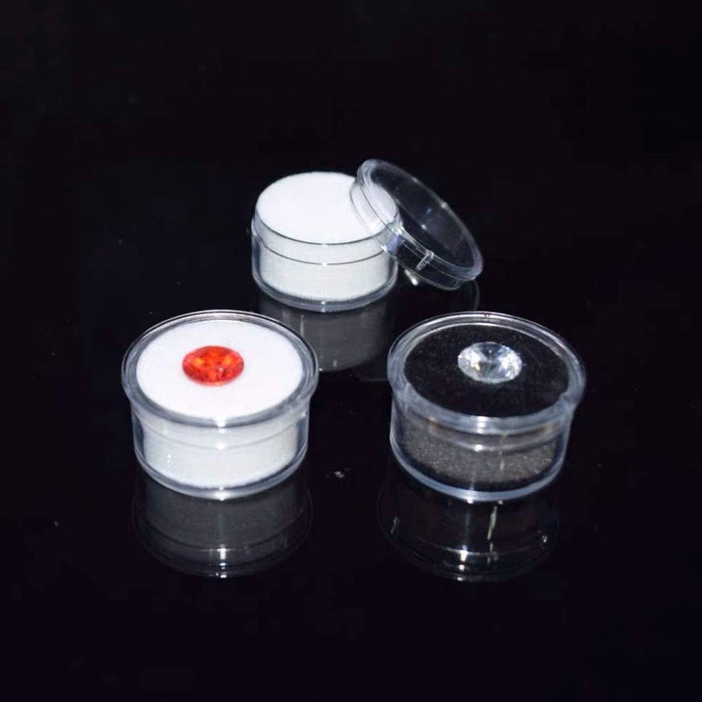 Round display boxes with red and clear gemstone stones, open-lid set of three