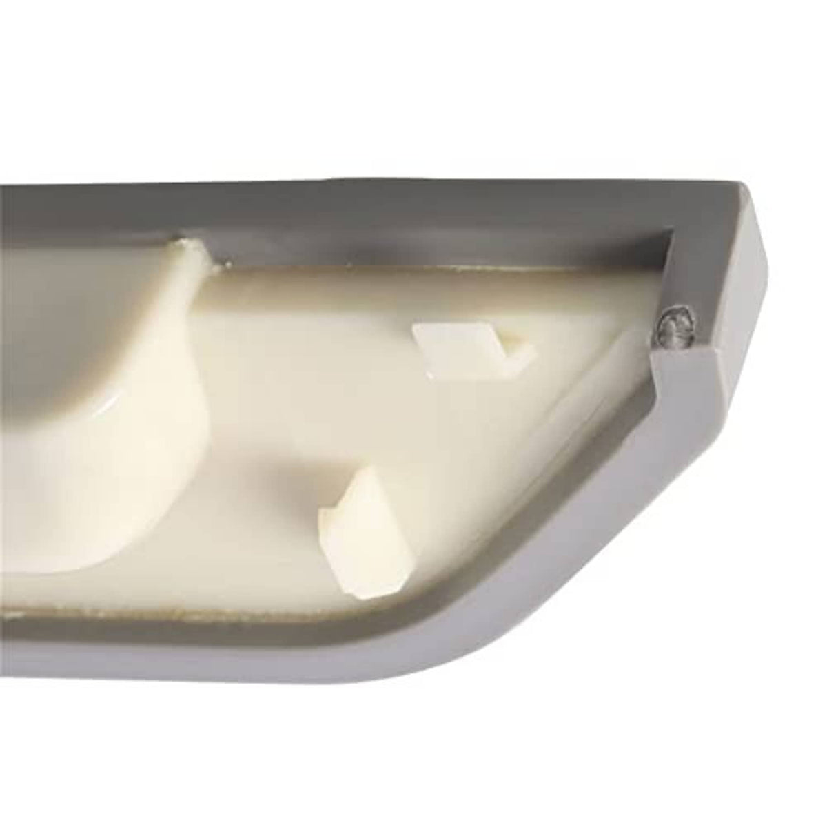 Back side of gray armrest cover with molded plastic clips and metal fastener