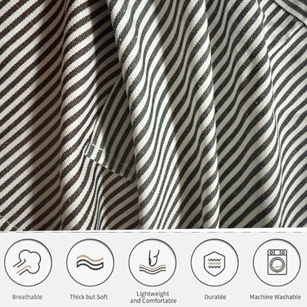 Black-and-white vertical striped apron fabric with black trim and stitched seam details