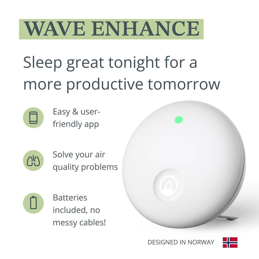 White indoor air quality monitor with green status light, front view