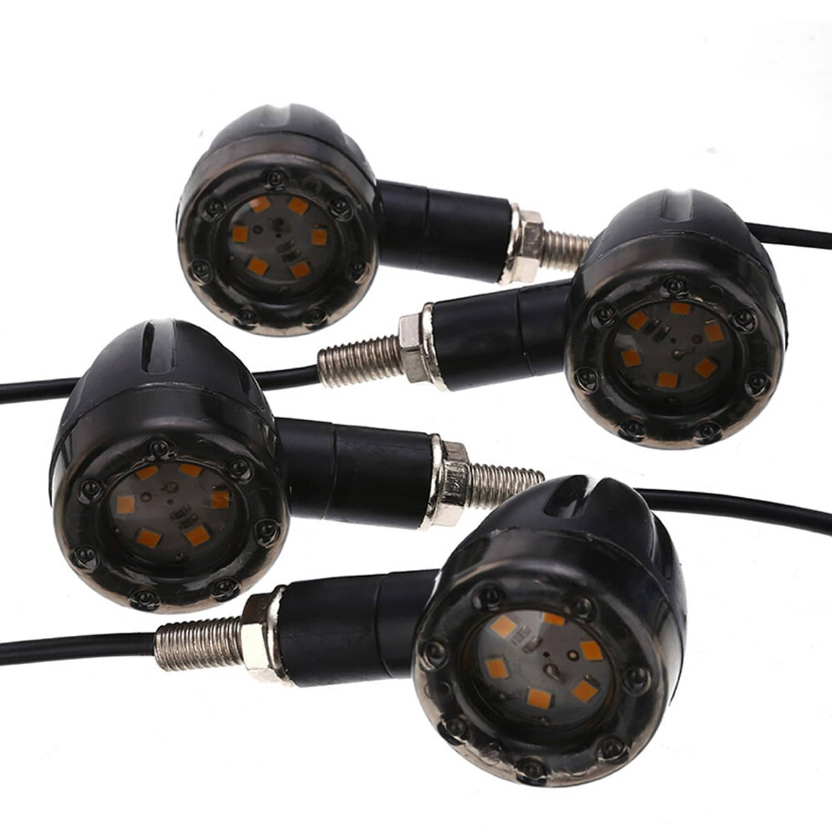 Four black motorcycle LED blinkers with visible orange diodes and threaded mounting posts