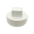 White PVC cleanout plug with male NPT threads and square cover top, threaded end