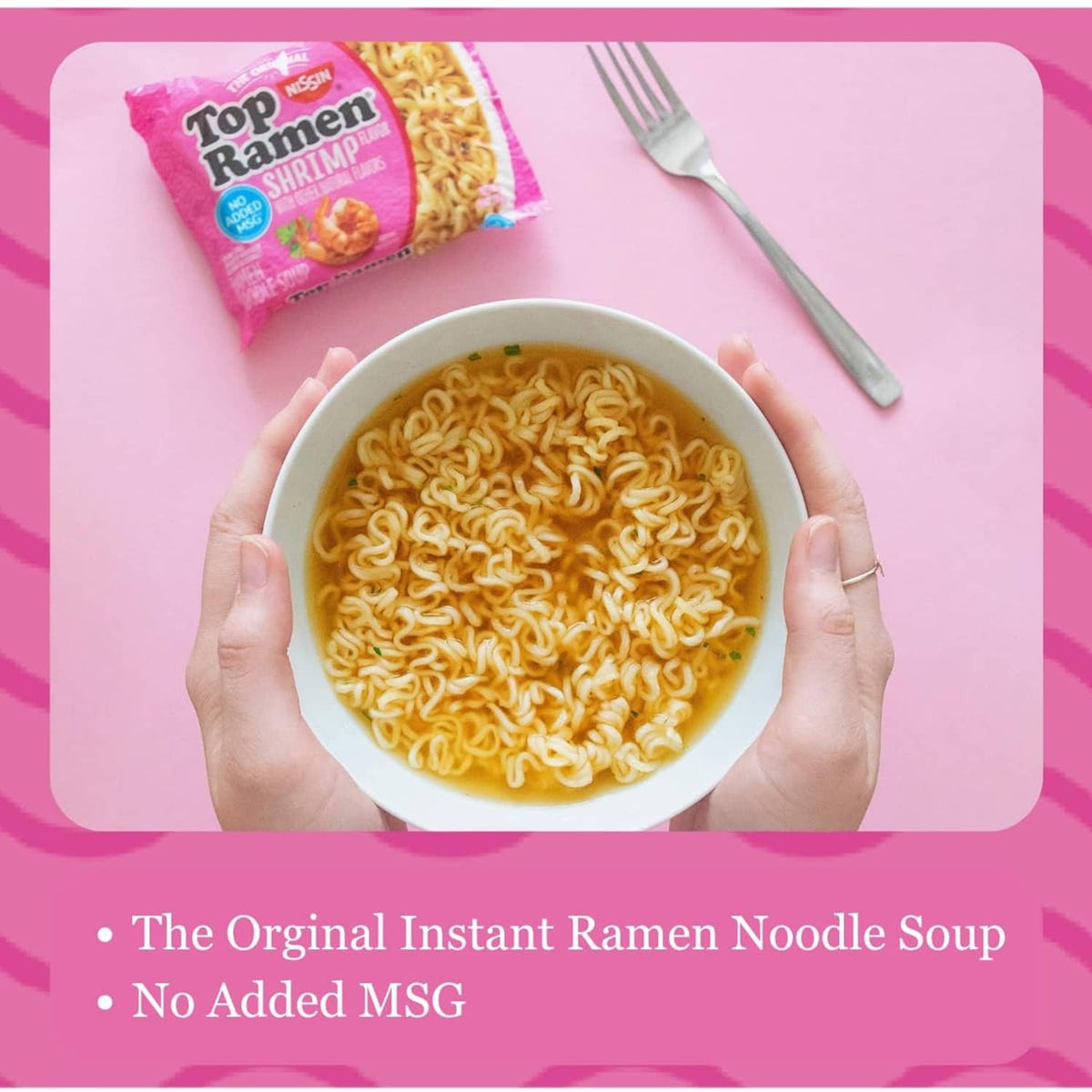Shrimp flavored ramen bowl held by hands with noodles filling