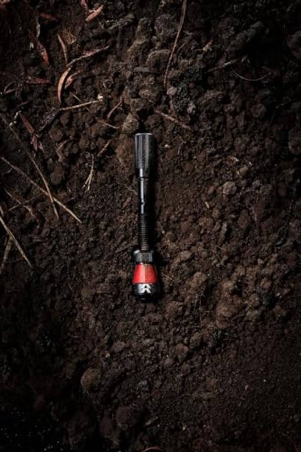 Black 90mm tubeless bike valve stem with red base ring and metal head