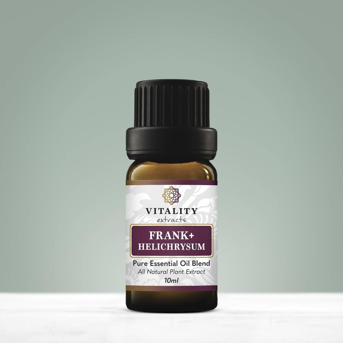 Frank+ Helichrysum pure essential oil blend bottle with black cap and label front.