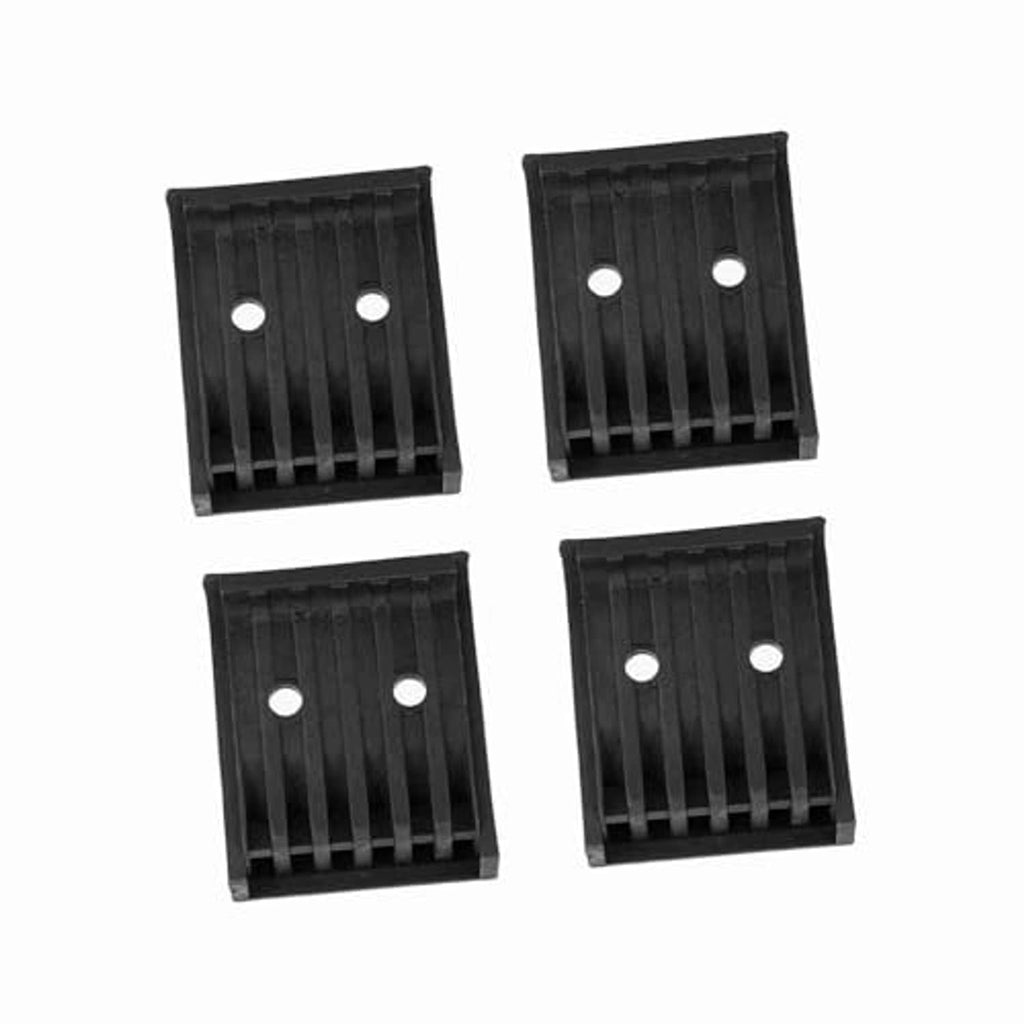 Four black tire changer jaw protector guards with vertical ribs and two mounting holes