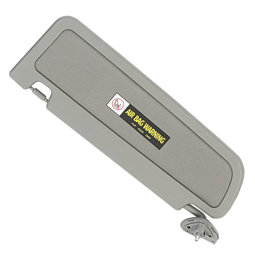 Grey sun visor with air bag warning label and mounting pin