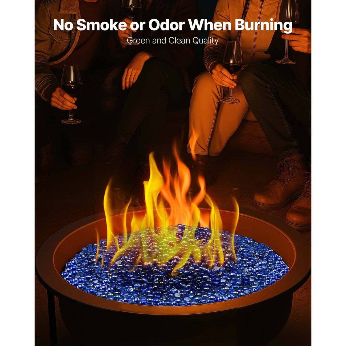 Cobalt blue fire pit glass rocks with burning flames in a round bowl