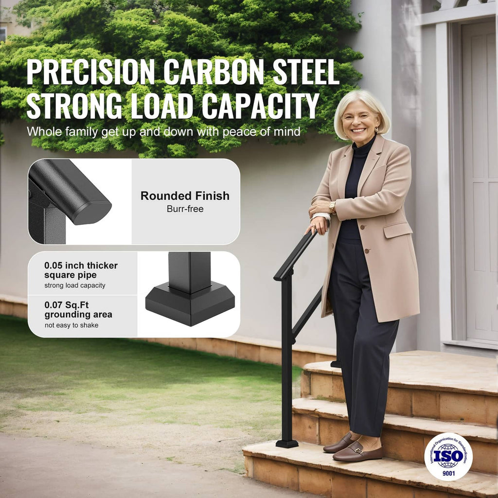 Black carbon steel stair handrail with rounded top rail on outdoor steps