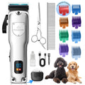 Silver dog hair clipper kit with guide combs, scissors, and charging accessories.