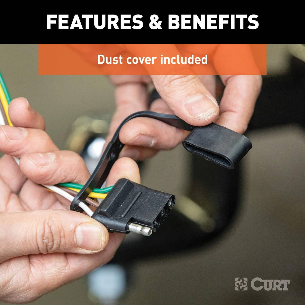 Dust cover being fitted onto a wiring connector for trailer converter