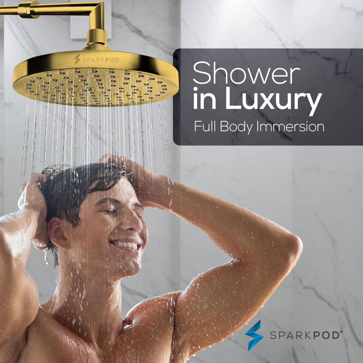 Egyptian gold round rain shower head spraying water over a shower user