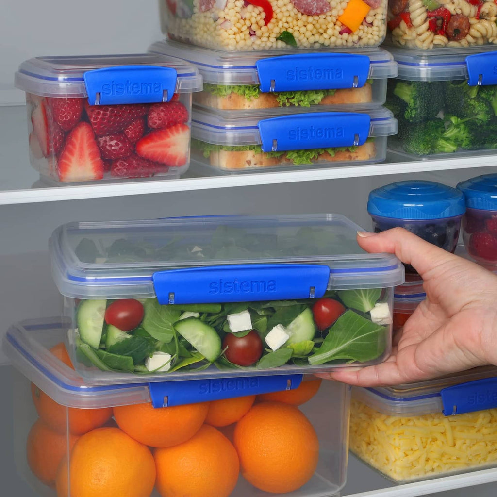 Rectangular food storage container stack with blue snap lids in fridge