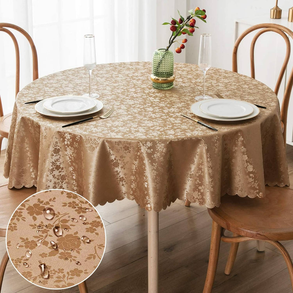 Round beige floral vinyl tablecloth with scalloped edge for dining table coverage