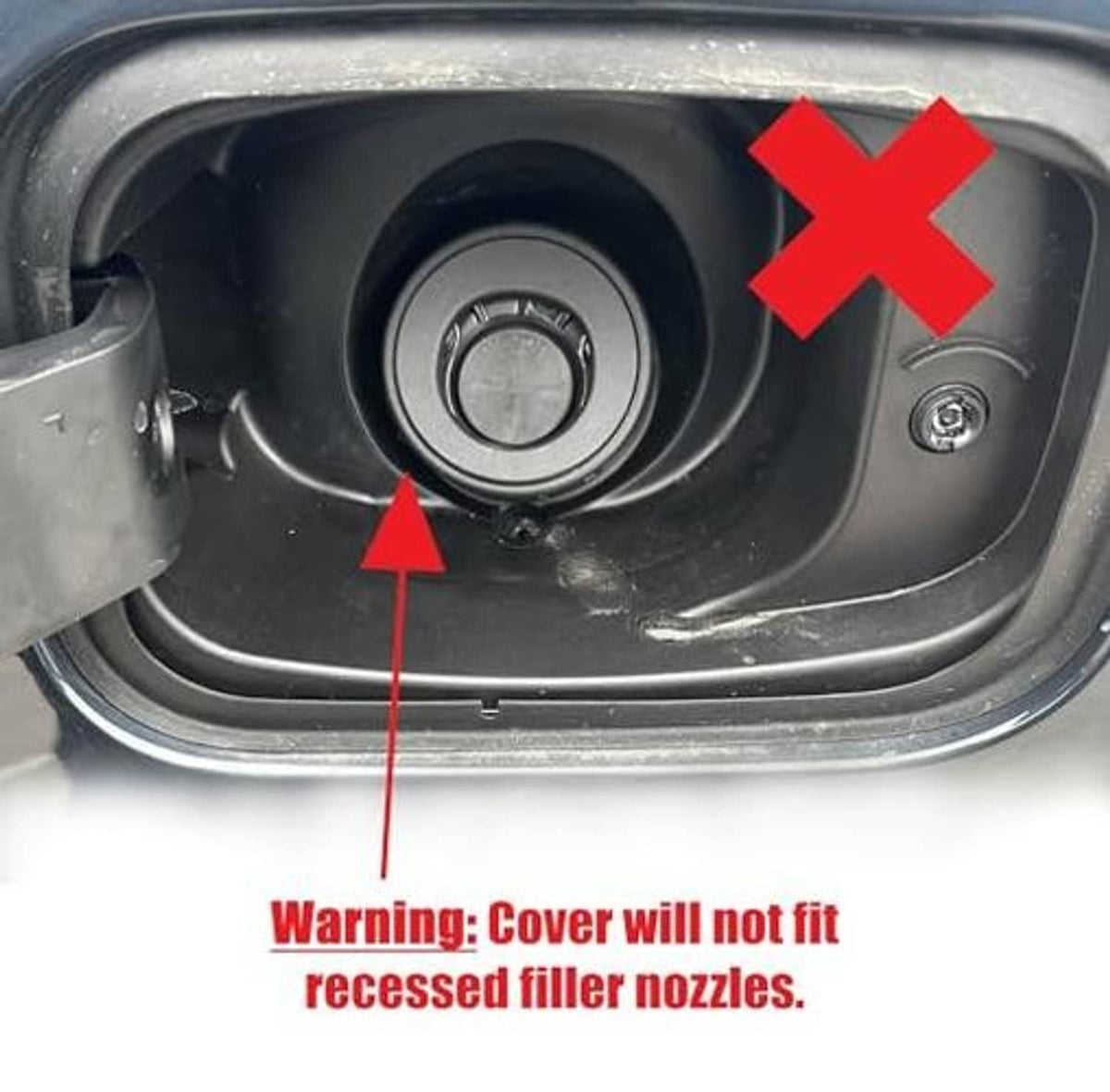 Capless gas cover and tethered black cap shown over the filler opening