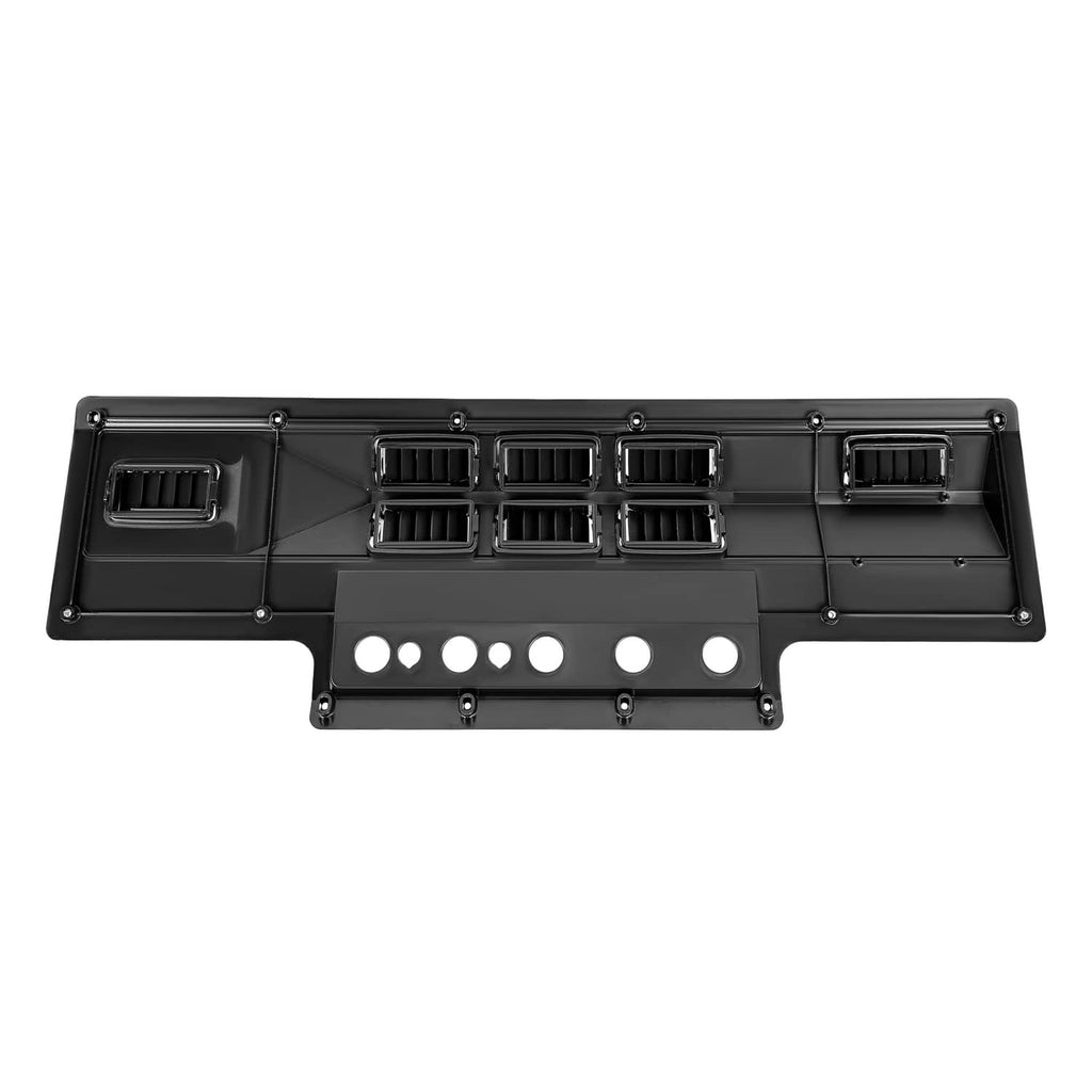 Black A/C heat control panel bezel with center vent grid and row of round indicator holes