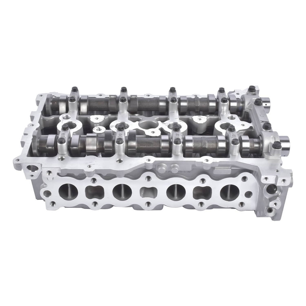 Aluminum cylinder head with camshafts and valve ports, bare metal engine part.