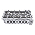 Aluminum cylinder head with camshafts and valve ports, bare metal engine part.