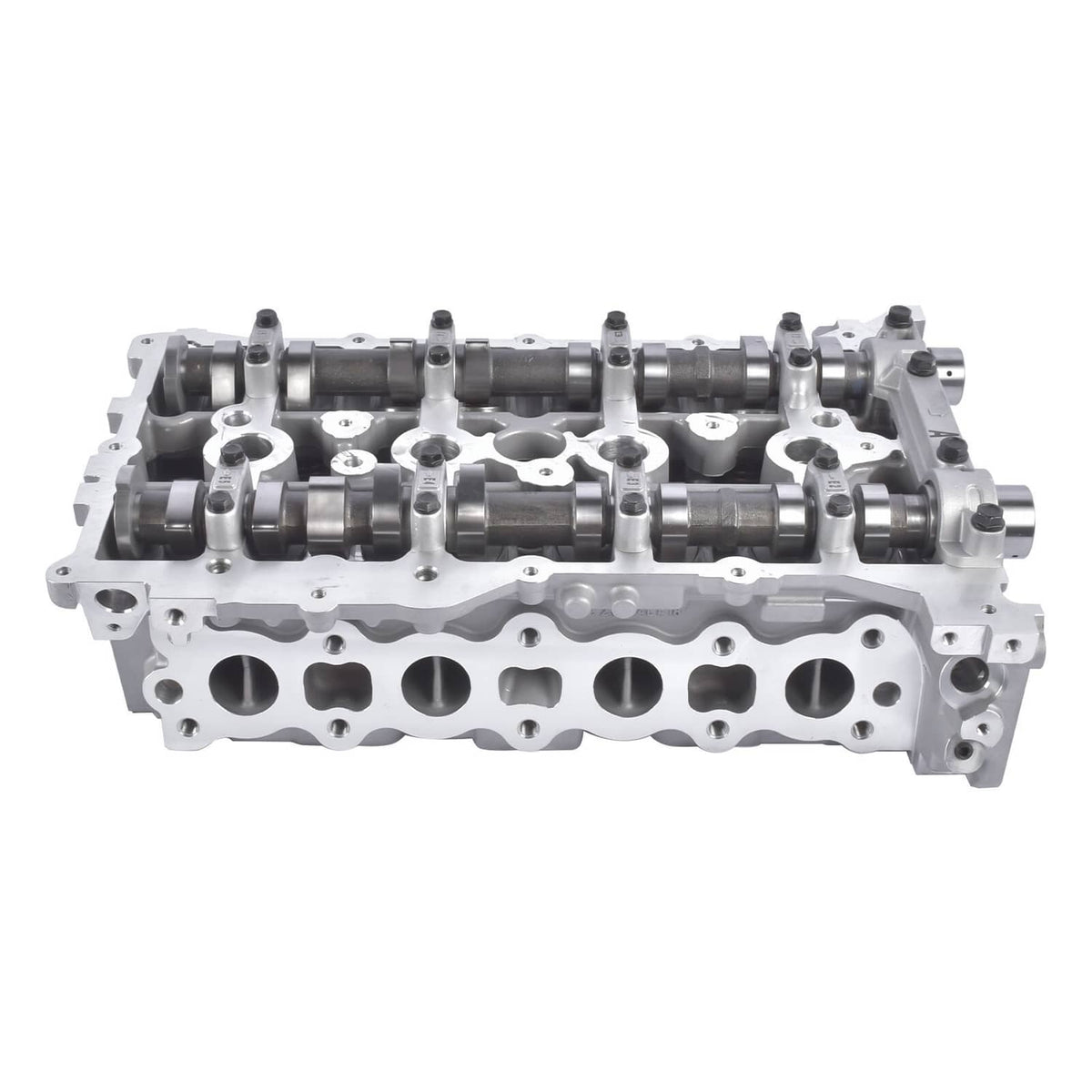 Aluminum cylinder head with camshafts and valve ports, bare metal engine part.