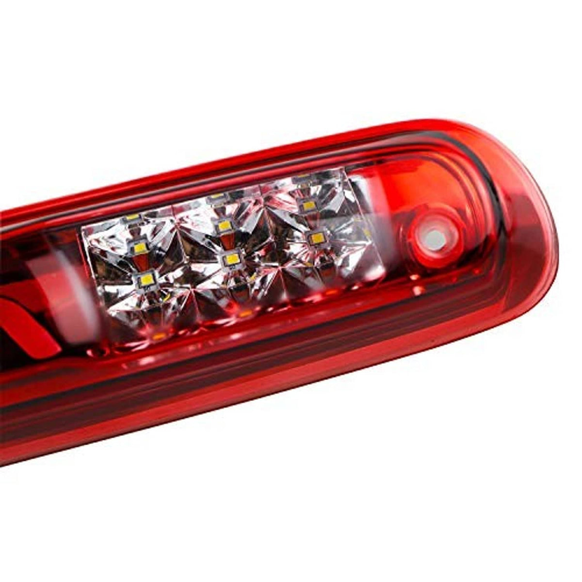 Close-up of red LED tail light with clear lens and chrome reflector segments