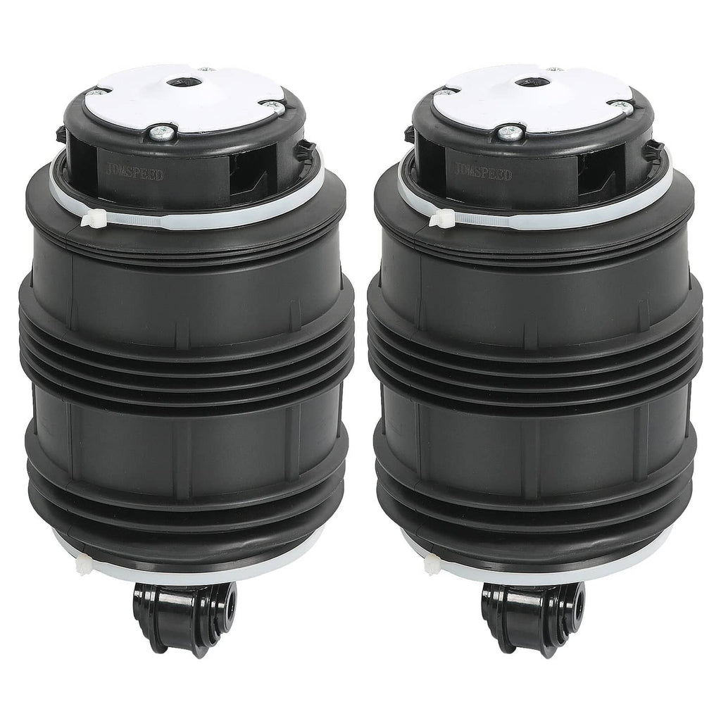 Pair of black rear air suspension springs with silver top plates and mounting holes.