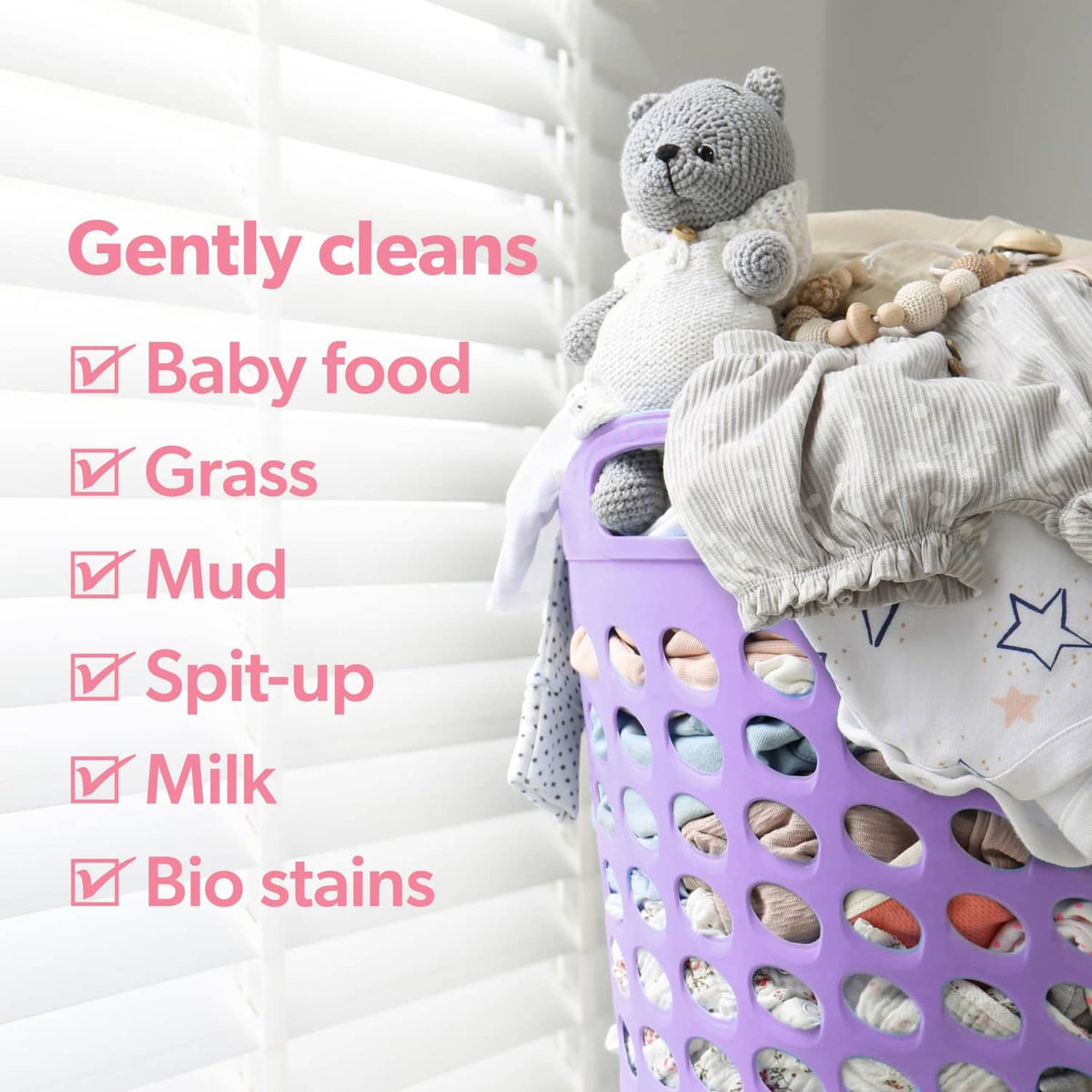 Dreft lavender laundry detergent pacs in a purple basket with baby clothes