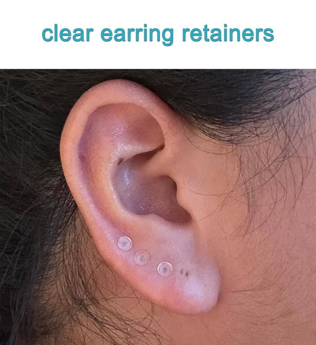 Clear earring retainer disc on an ear after piercing placement