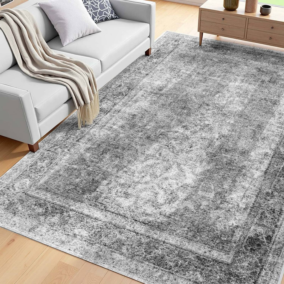 Gray 6x9 ft area rug with distressed abstract pattern and low-pile look