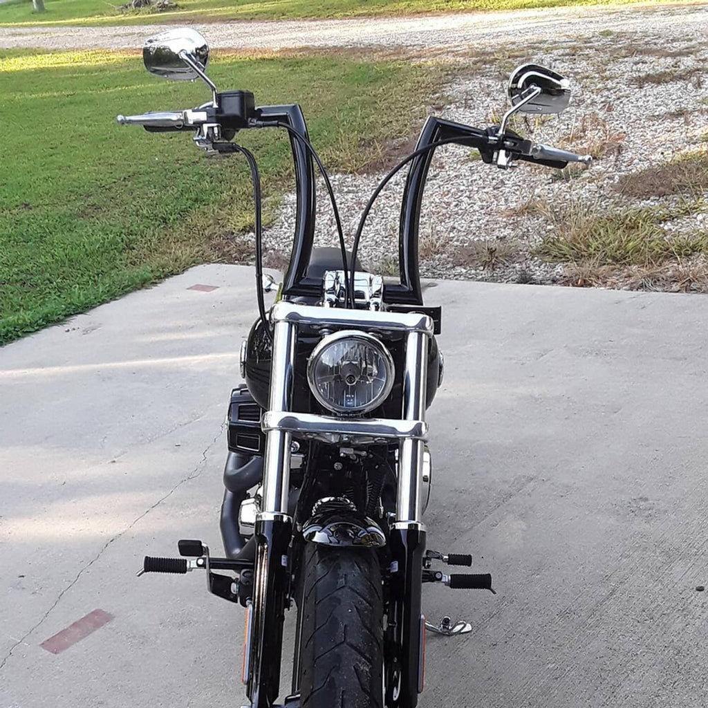 Black ape-style motorcycle handlebars with built-in grips on front view bike