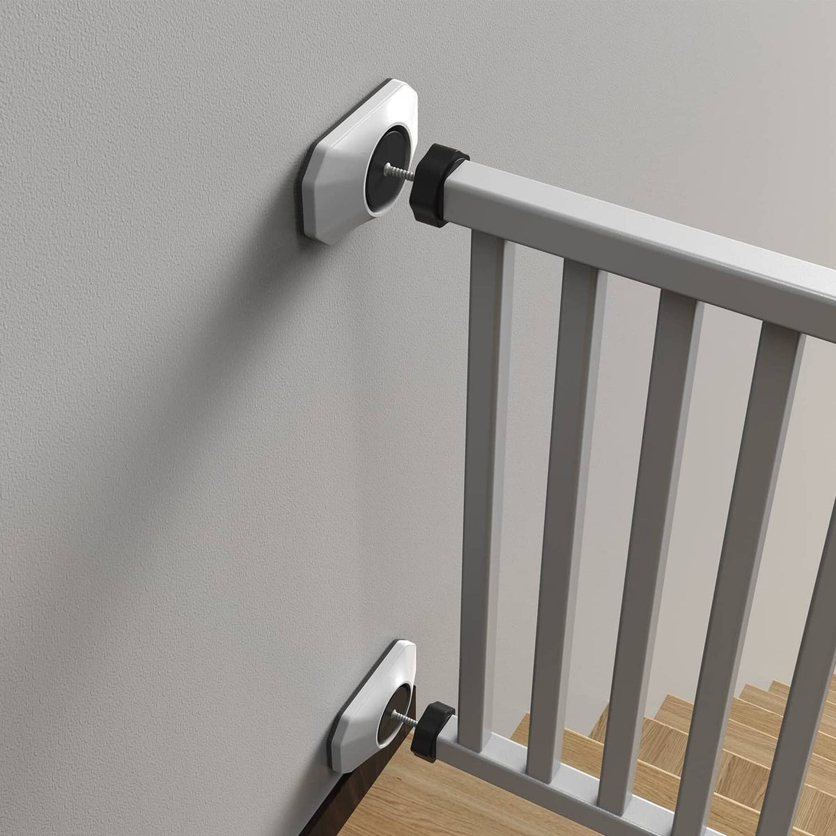 Baby gate wall protector set mounted at gate side, white base and black screw caps