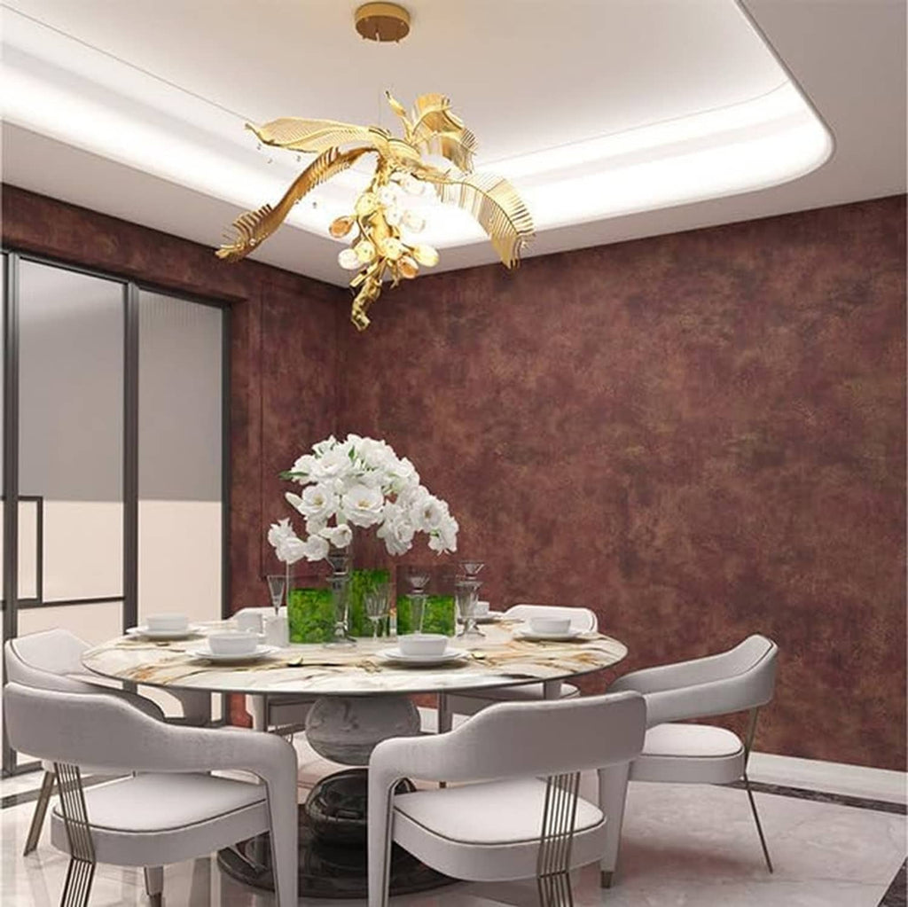 Burgundy metallic copper-gold peel-and-stick wallpaper on a dining room accent wall