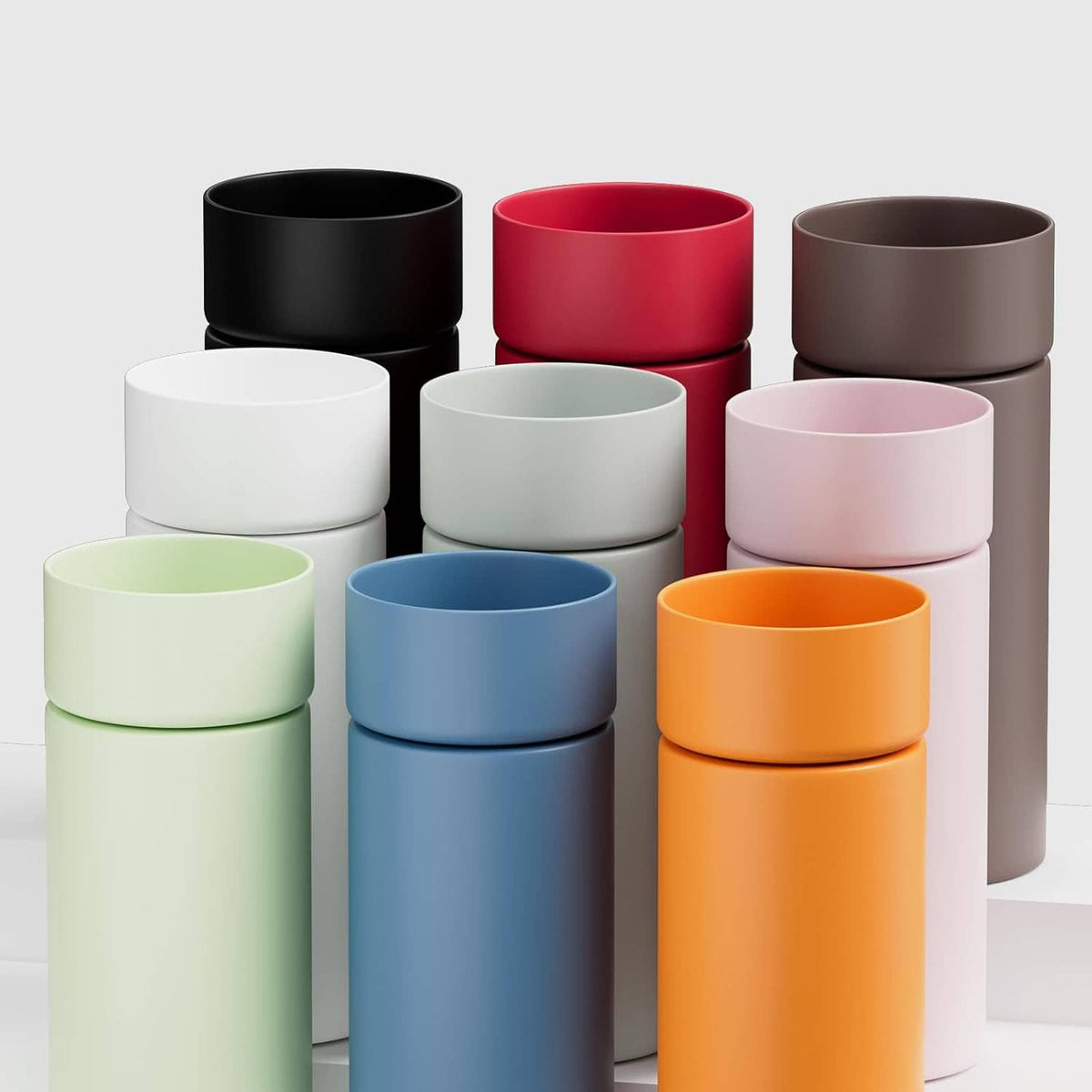 Set of silicone bottle boots in multiple colors, including black, red, orange, and blue