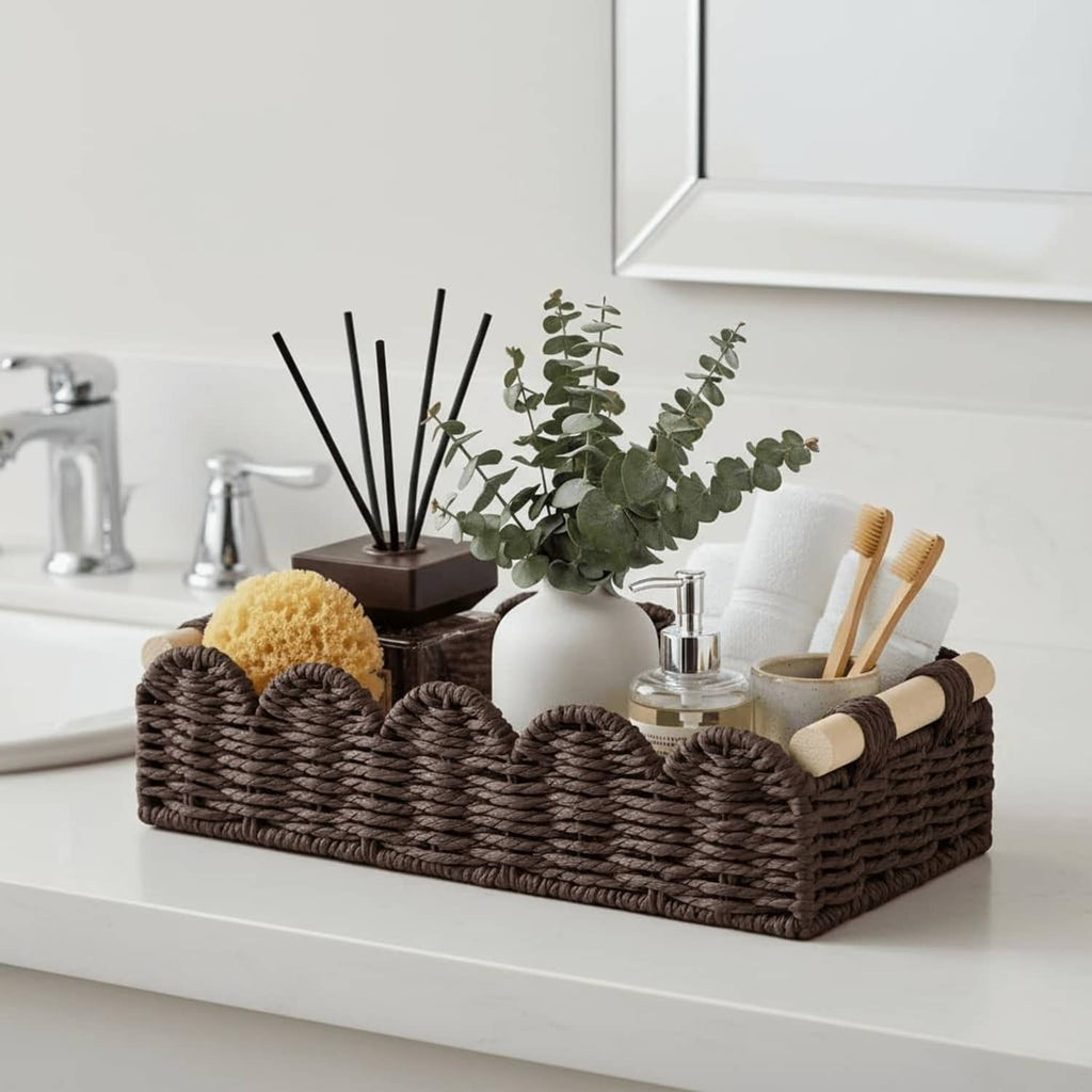 Brown woven toilet paper holder basket with multiple rolls and beige rope side handles