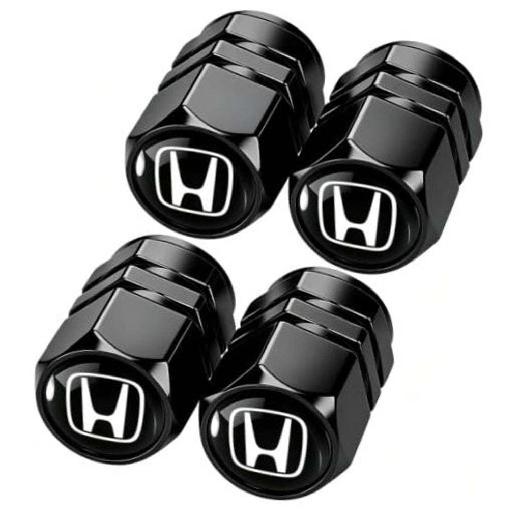 Set of black metal tire valve stem caps with Honda logo, hex design