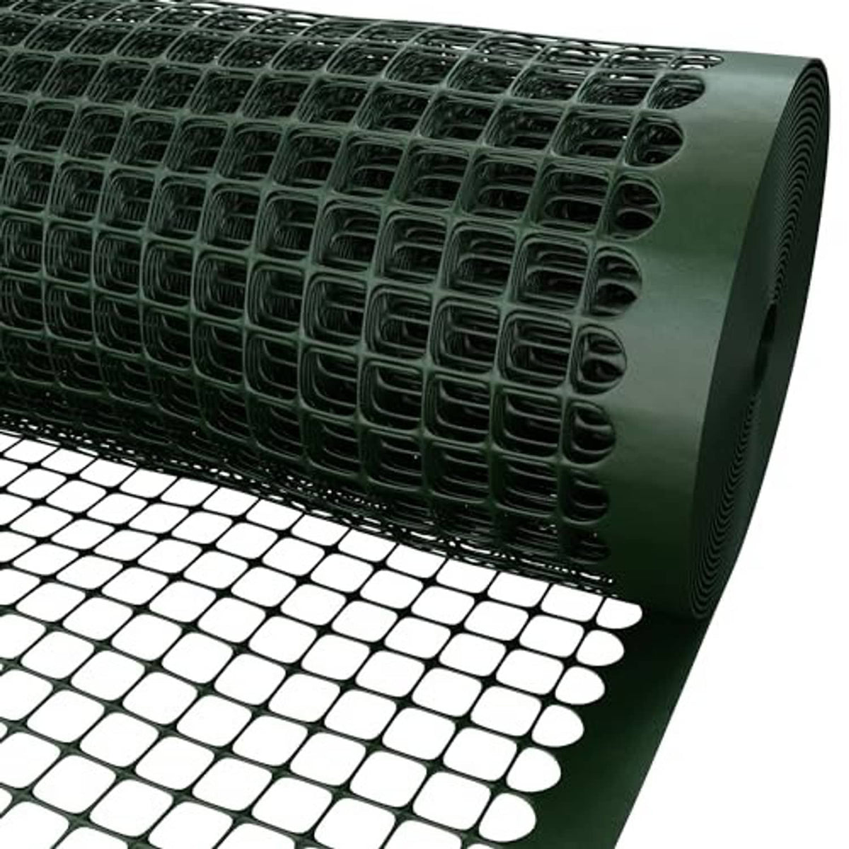 Green square-mesh plastic fence roll close-up showing dense grid and curled edge