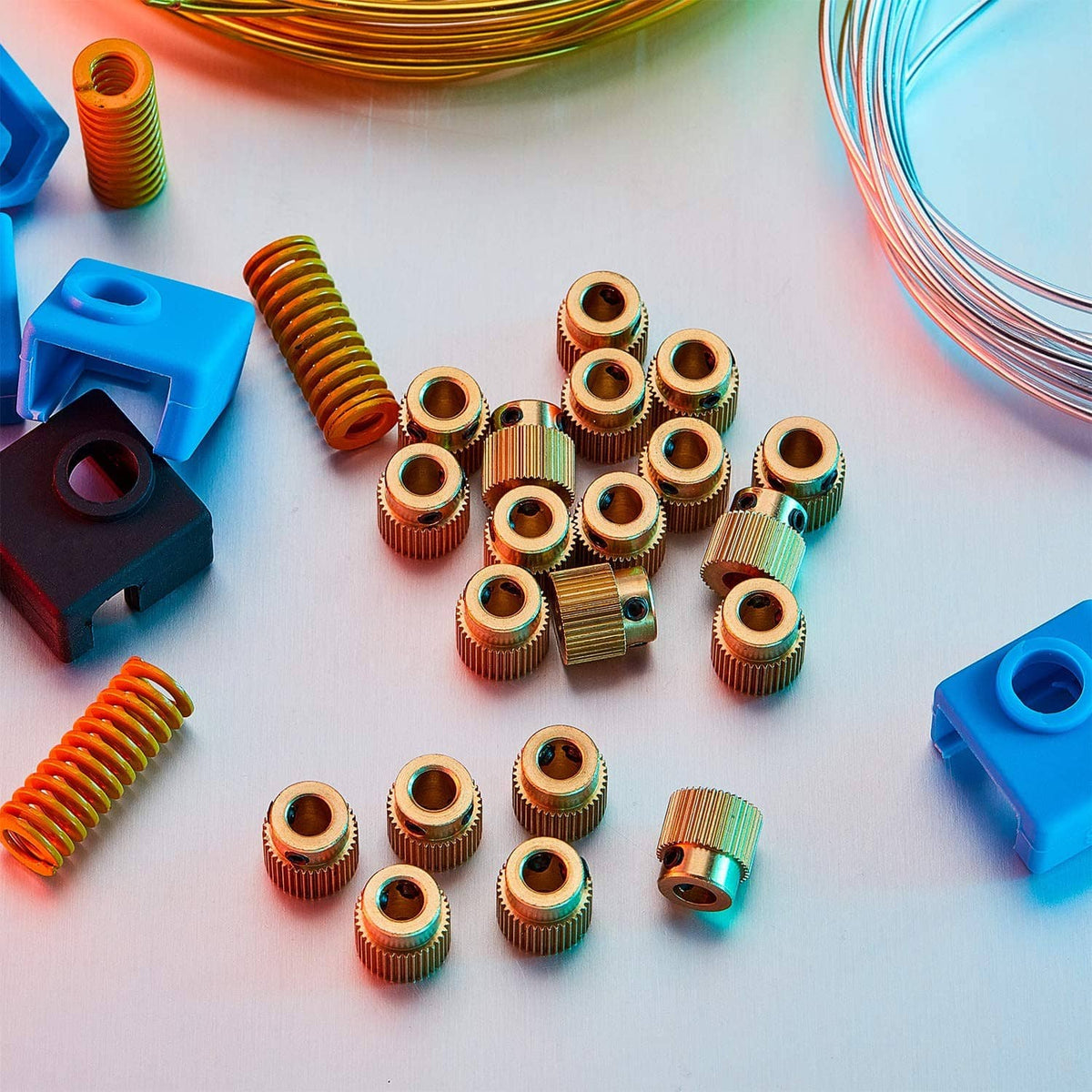 Assorted brass extruder drive gears, ribbed cylinders with black side inserts