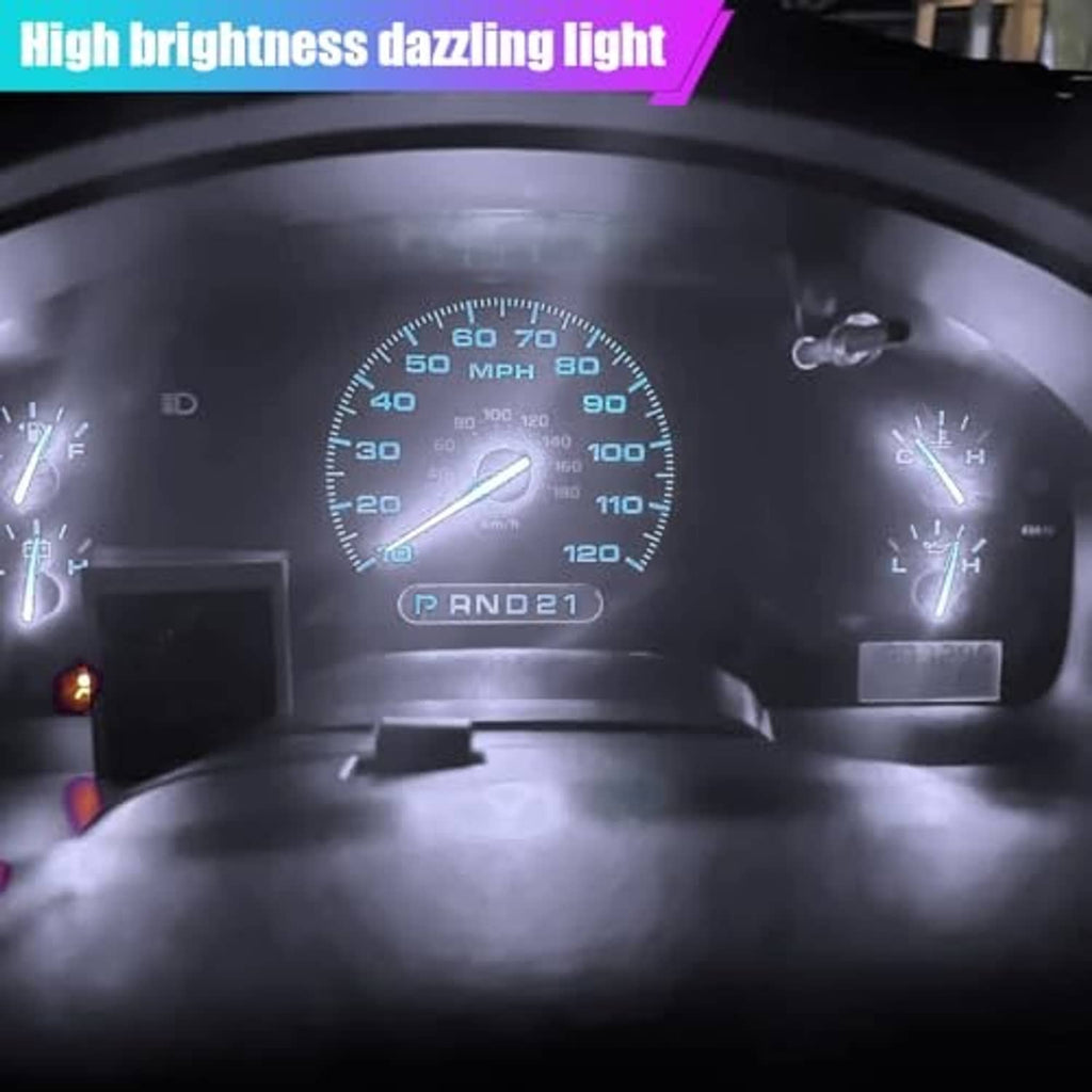 Vehicle dashboard instrument panel with bright LED light glow around gauges