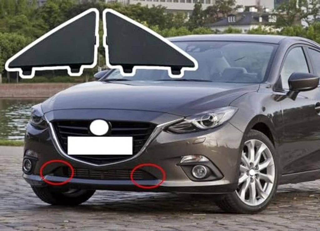 Pair of dark triangular front bumper grille filler inserts outlined for front placement